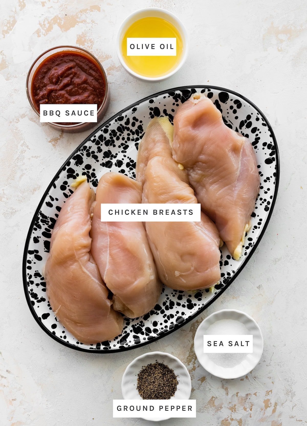 Grilled BBQ Chicken Breasts ingredients: Chicken breasts, BBQ sauce, olive oil, sea salt, ground pepper.