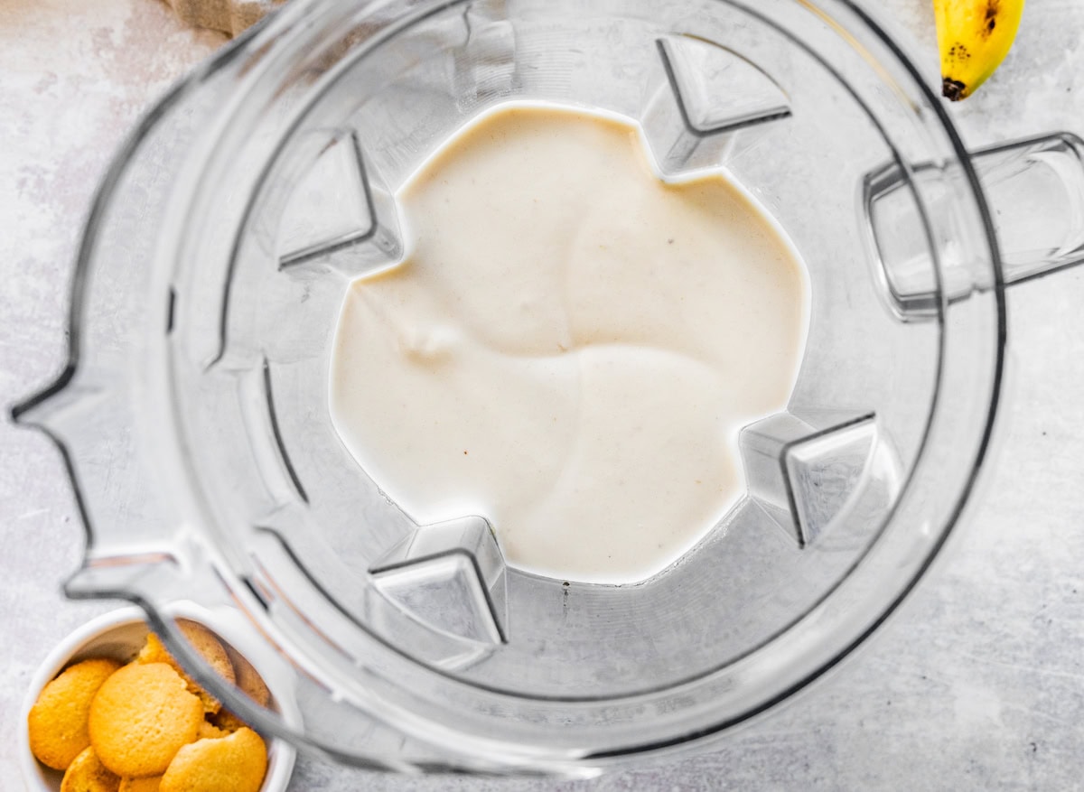 Blended high-protein banana pudding in the base of a blender.
