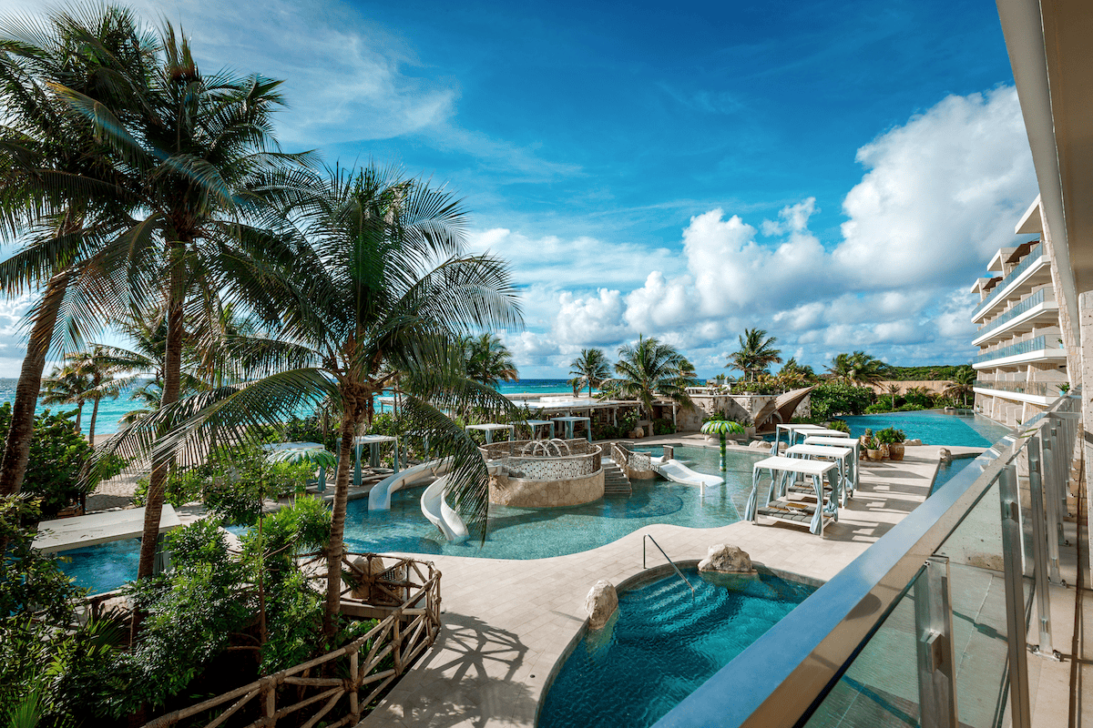 The children's pool with slides at a Mexico resort near the ocean.