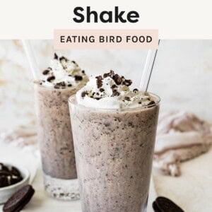 Cookies and cream protein shake topped with whipped cream and crushed cookies.