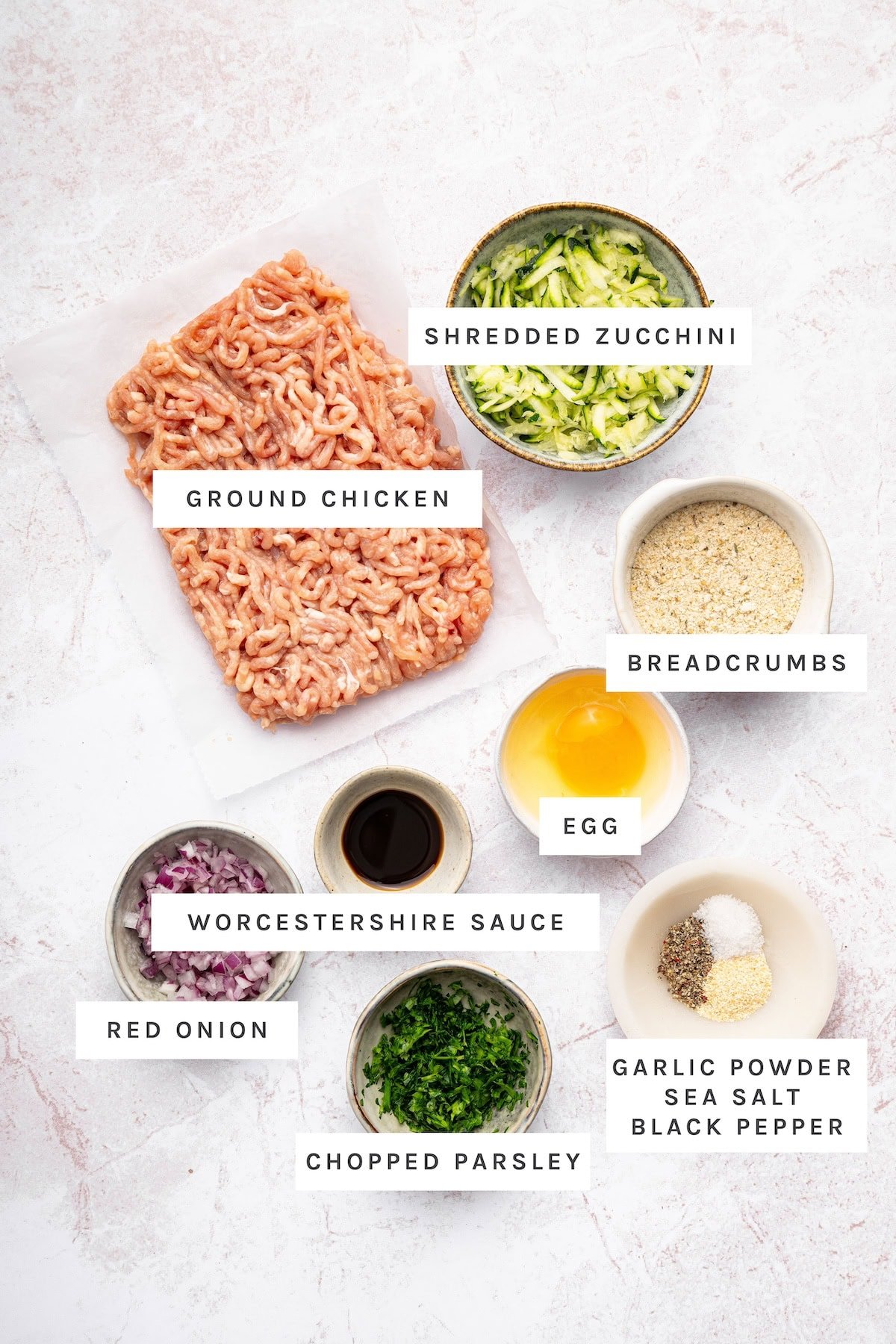 Chicken Burgers ingredients: Ground chicken, shredded zucchini, breadcrumbs, egg, Worcestershire sauce, red onion, chopped parsley, garlic powder, sea salt, black pepper