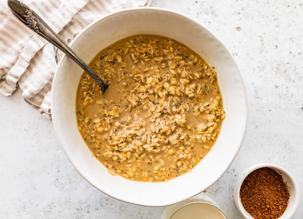 Mixed oats, coffee, and chia seeds in a bowl before layering.