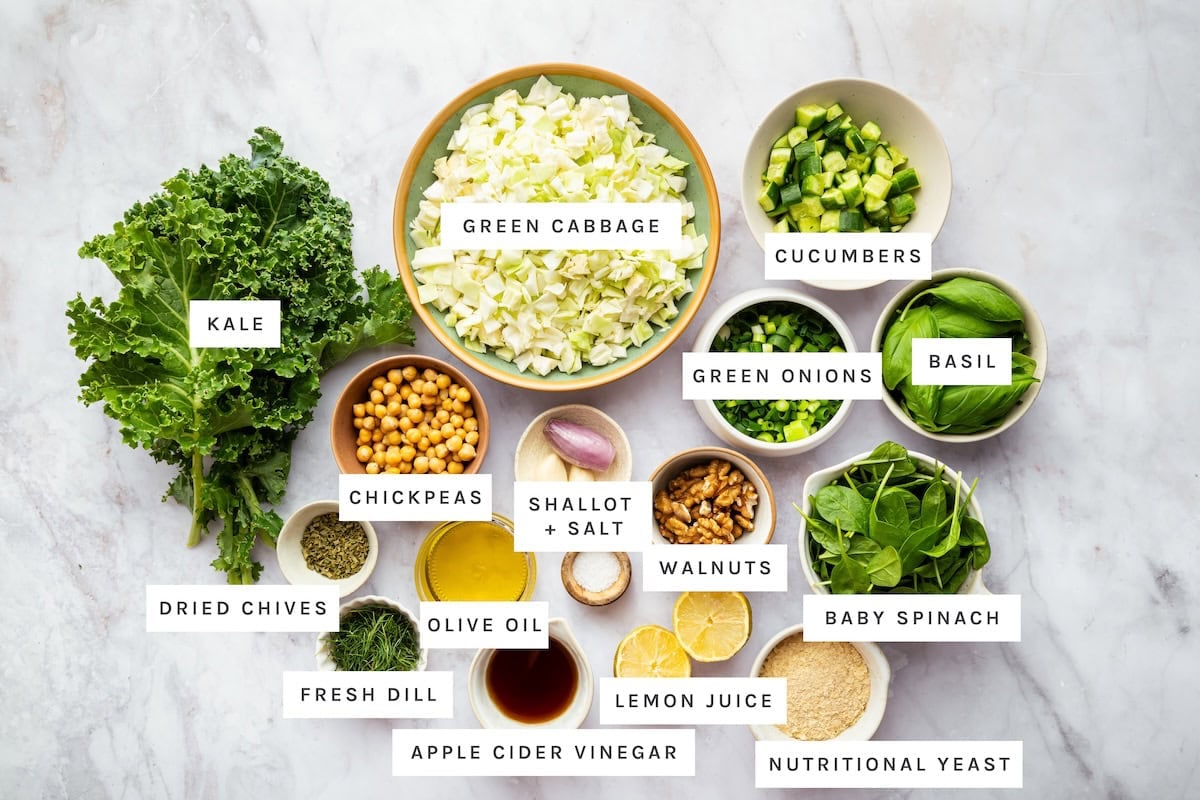Green Goddess Salad (Viral Recipe): Kale, Green cabbage, Cucumbers, Green onions, Basil, Chickpeas, Shallot, Salt, Walnuts, Baby spinach, Dried chives, Olive oil, Fresh dill, Lemon juice, Apple cider vinegar, Nutritional yeast