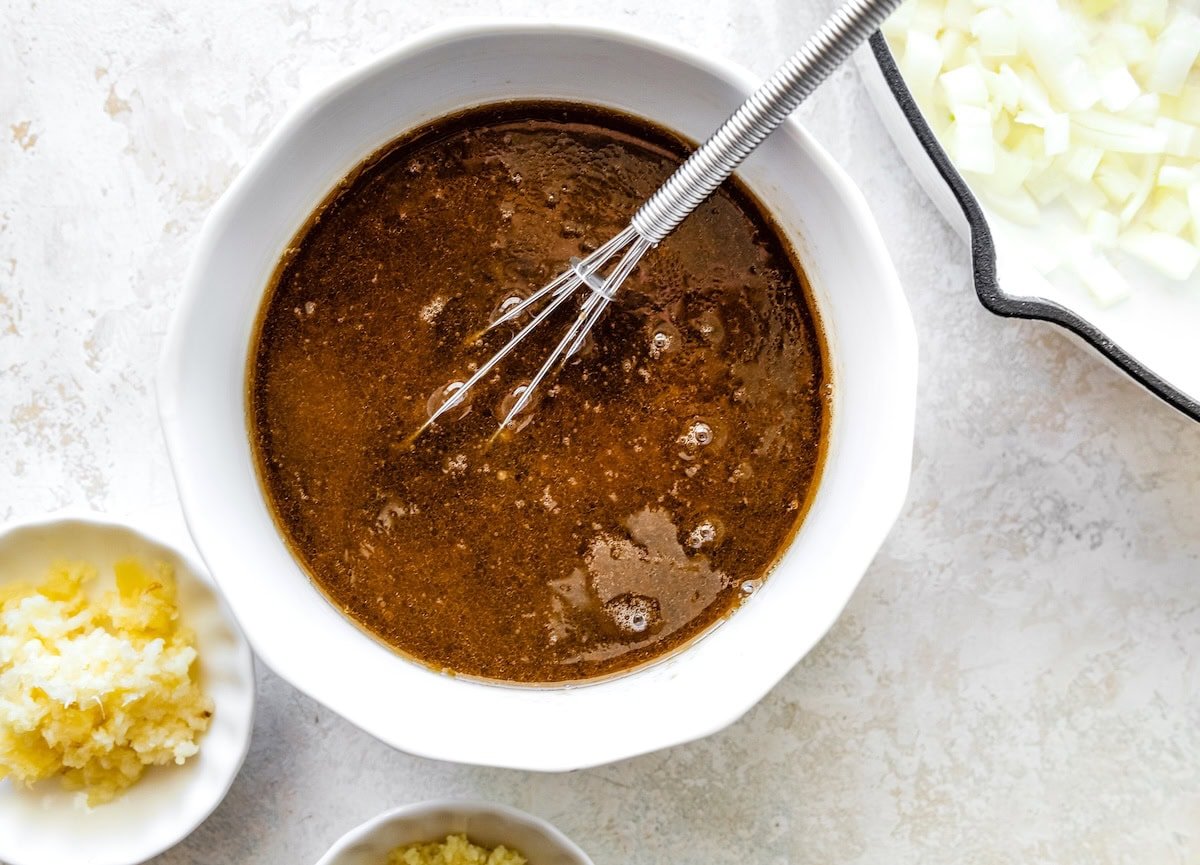 A homemade sauce with soy sauce, sesame oil, rice vinegar, fish sauce, and more.