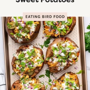 ChatGPT said: Baked sweet potato stuffed with shredded buffalo chicken, jalapeños, red onion, green onion, and ranch dressing being poured on top.