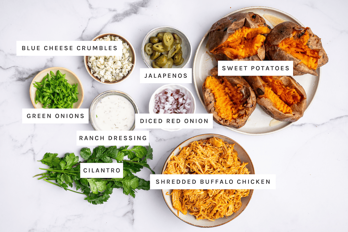 Blue cheese crumbles, jalapenos, sweet potatoes, green onions, diced red onion, ranch dressing, cilantro, shredded buffalo chicken