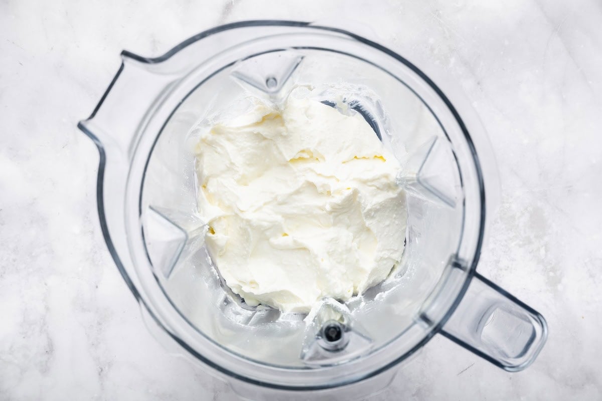 Cottage cheese in a blender ready to be blended smooth for pizza dough.