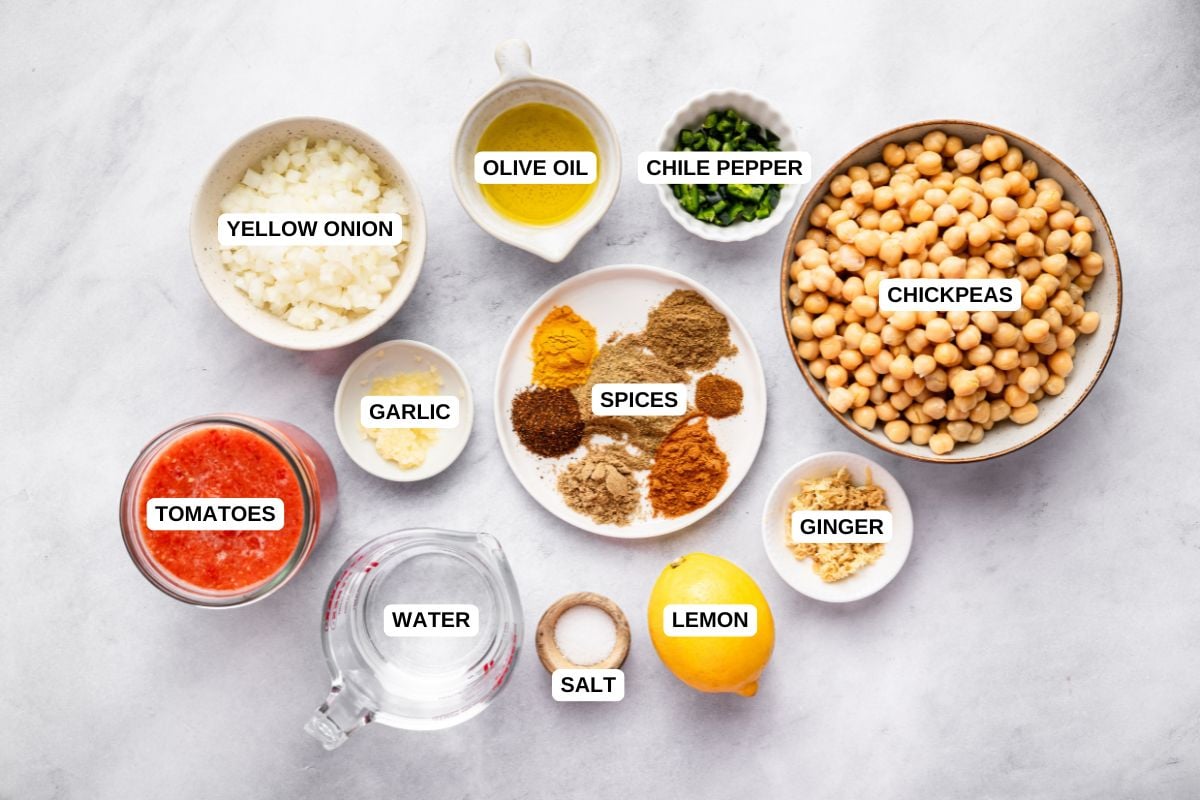 Yellow onion, olive oil, green chile pepper, chickpeas, garlic, tomatoes, water, freshly grated ginger, lemon, sea salt, garam masala, ground cumin, ground coriander, turmeric, chili powder, paprika, cayenne pepper.