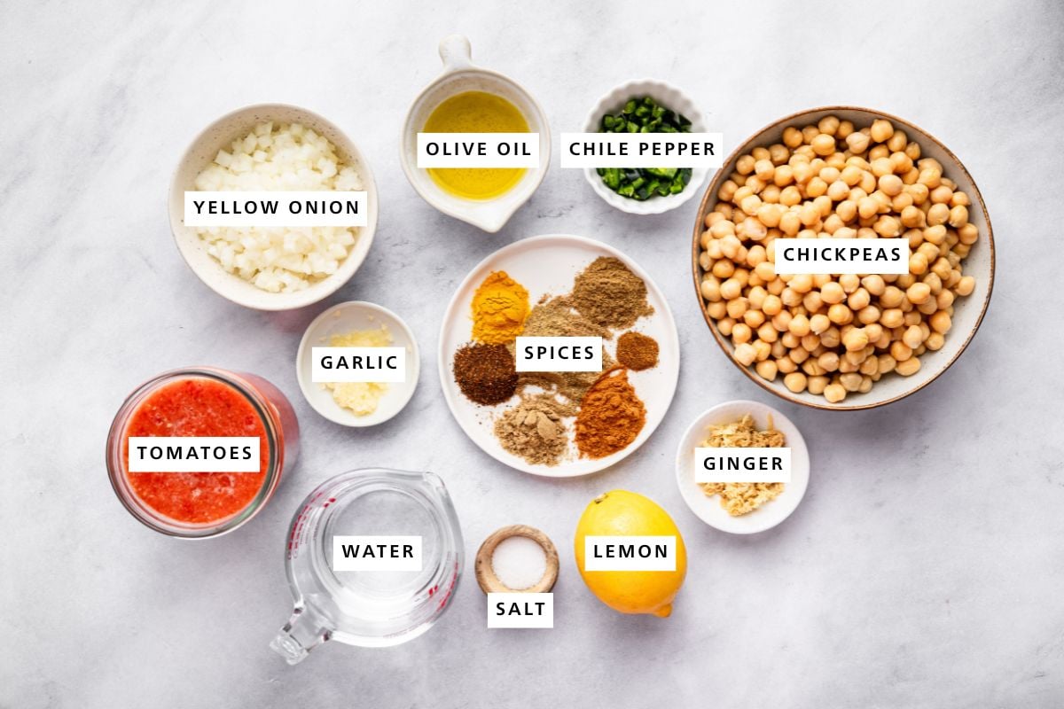 Yellow onion, olive oil, green chile pepper, chickpeas, garlic, tomatoes, water, freshly grated ginger, lemon, sea salt, garam masala, ground cumin, ground coriander, turmeric, chili powder, paprika, cayenne pepper.