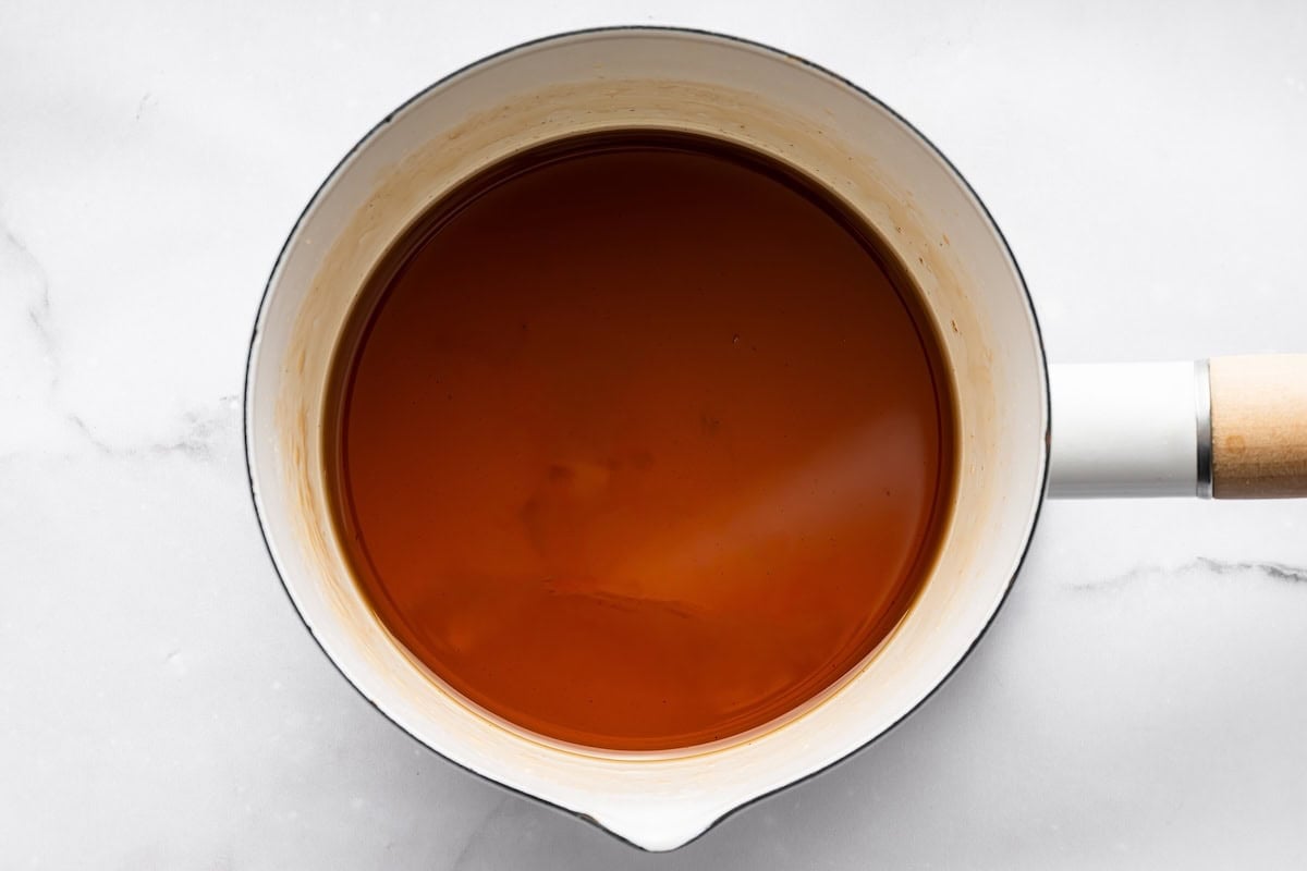 Top view of freshly brewed espresso with a rich caramel color in a small bowl.