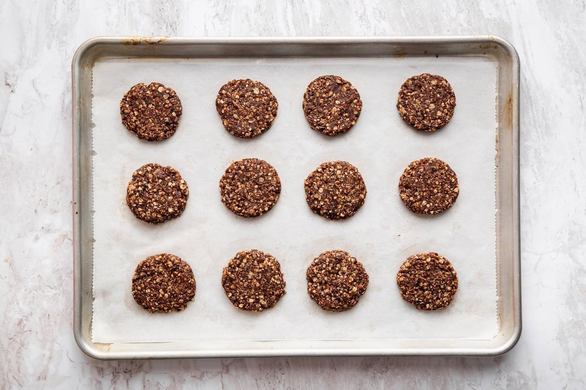 No bake cookies on a baking tray with parchment paper.