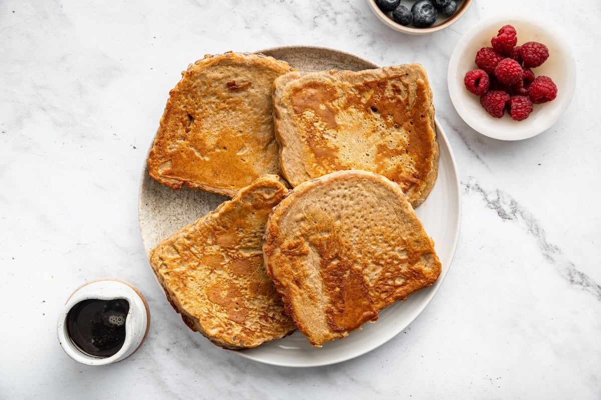 Slices of bread dipped in protein French toast batter.