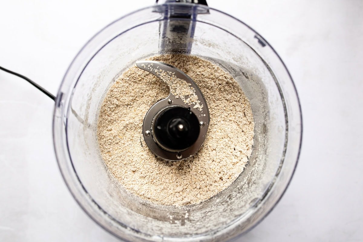 Rolled oats blended to make oat flour in a food processor.