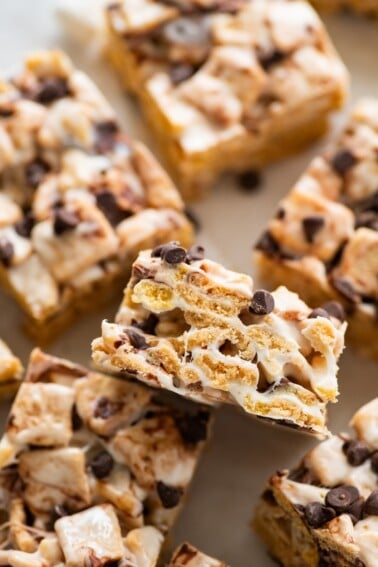 High protein s'mores treats near one another on parchment paper.