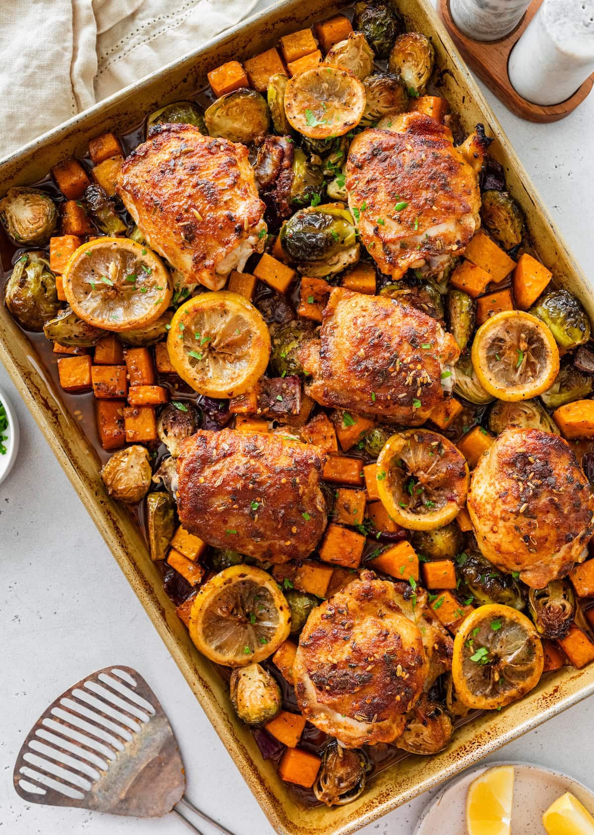 Sheet pan chicken and veggies Sheet pan chicken and veggies with roasted Brussels sprouts, butternut squash, and lemon slices.