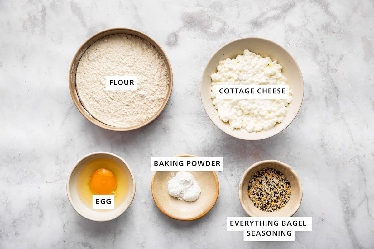 Ingredients for cottage cheese bagels: flour, cottage cheese, egg, baking powder and everything bagel seasoning.
