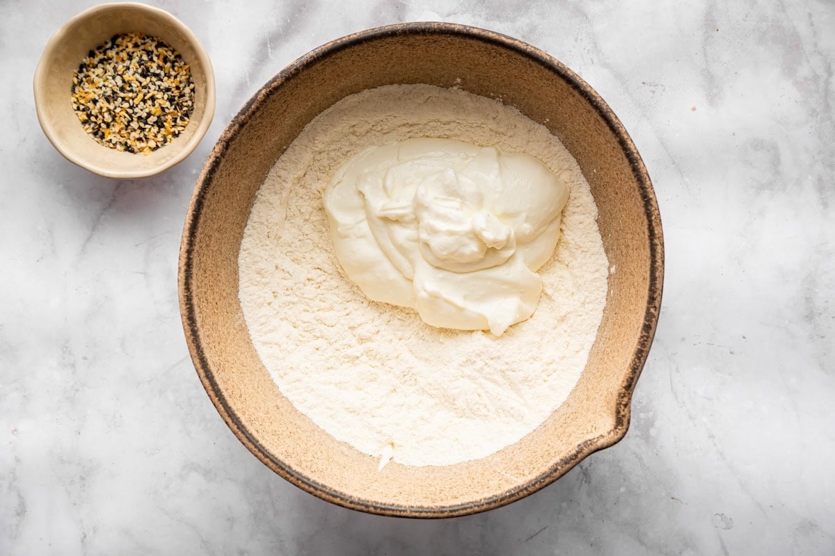 Ingredients for the cottage cheese bagels in a bowl ready to be mixed together.