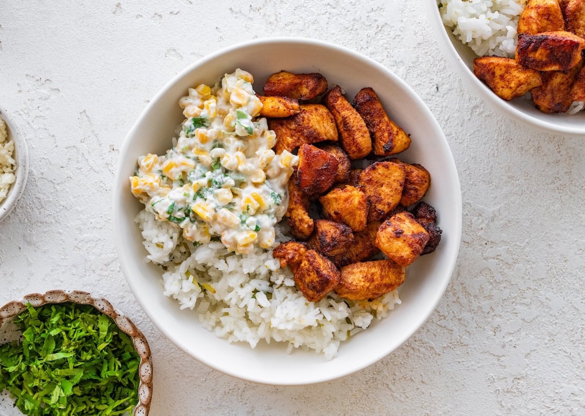A serving of a street corn chicken and rice bowl.