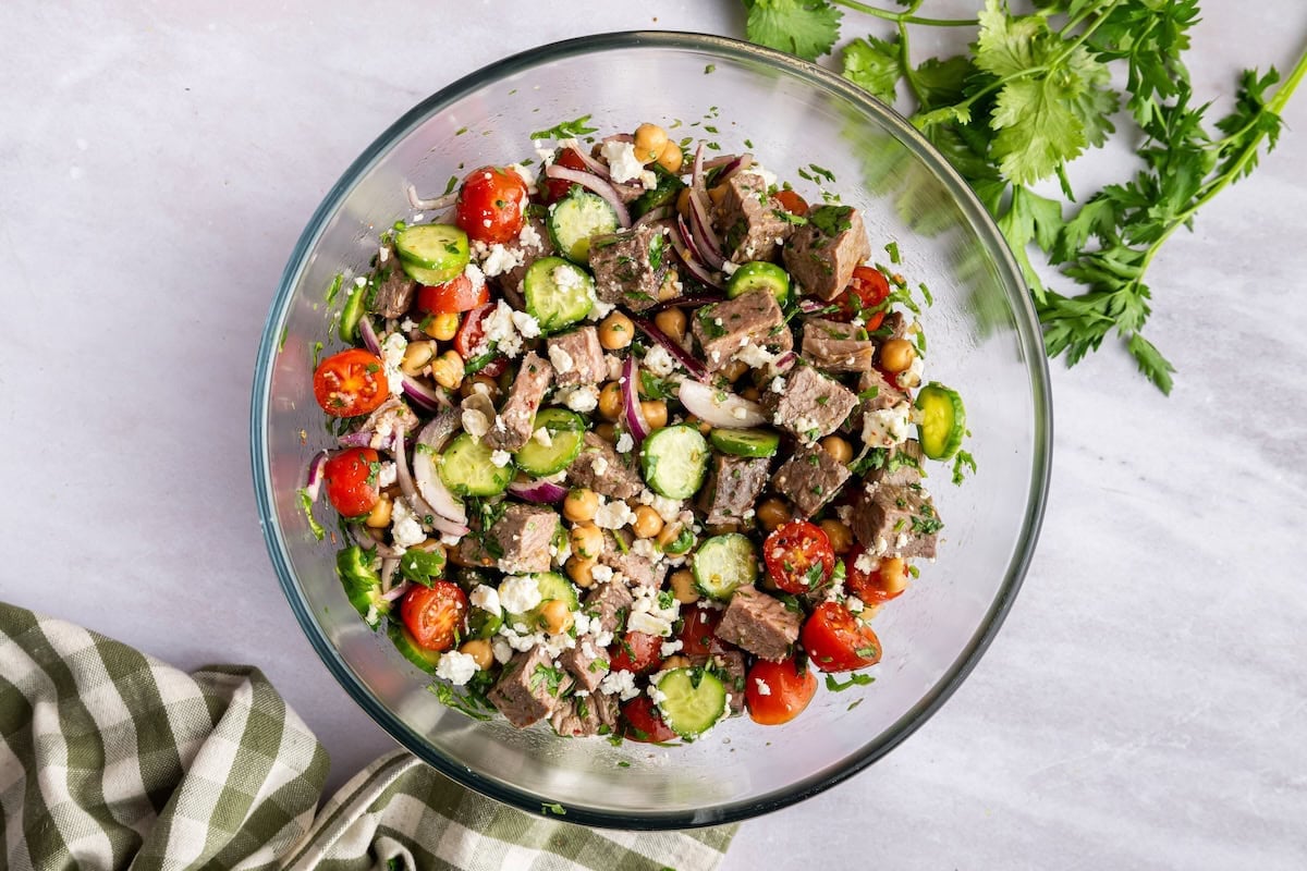 A chimichurri salad in a large glass bowl.