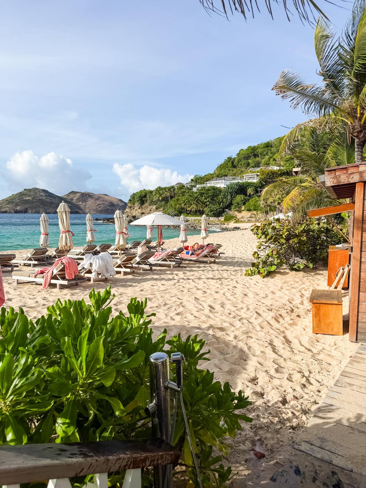 Eden Rock beach club with lounge chairs and turquoise water at St. Jean Bay