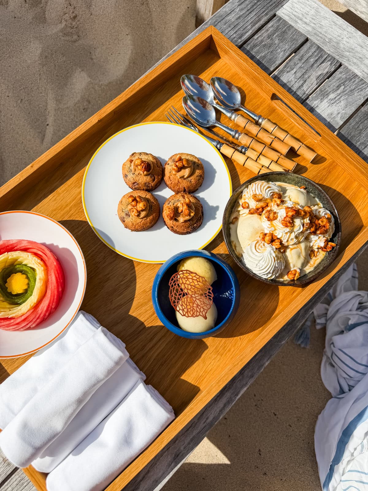 Cheval Blanc beach club dessert spread with muffins, meringue, and chocolate treats