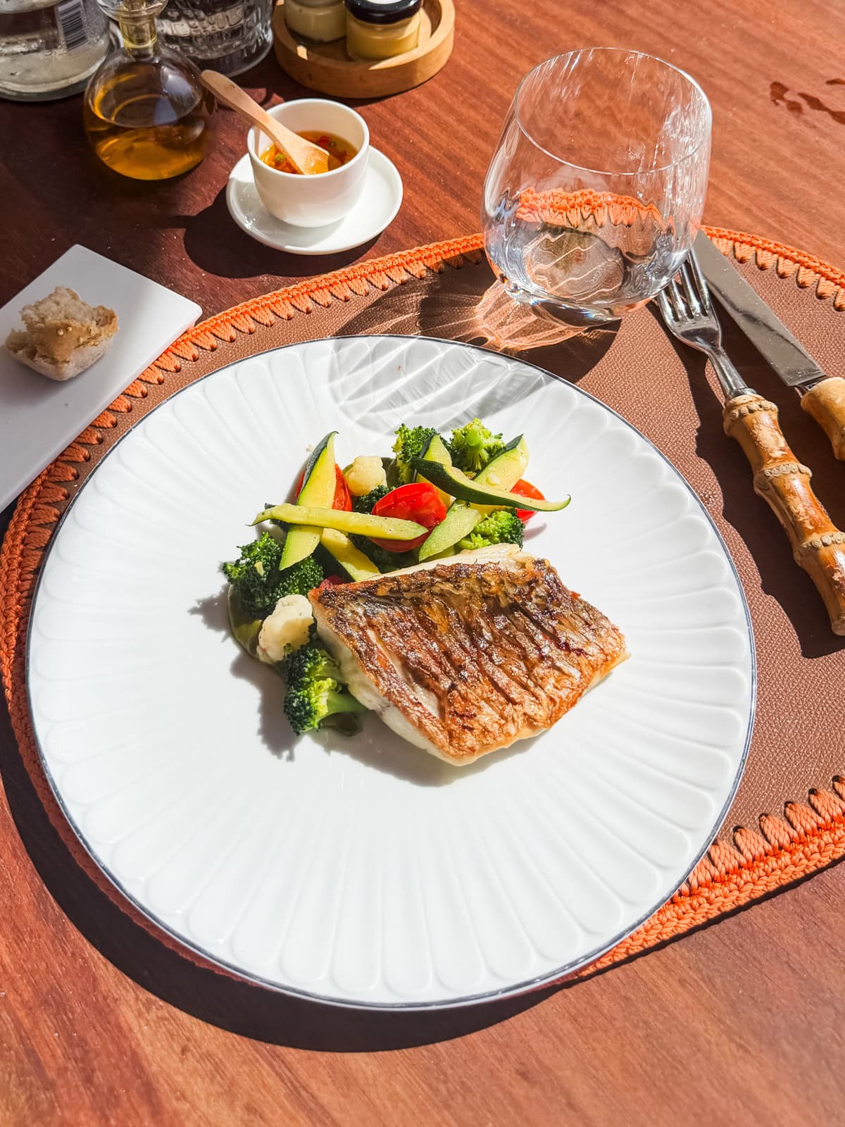 Seared white fish fillet with broccoli and vegetables at Cheval Blanc in St. Barths