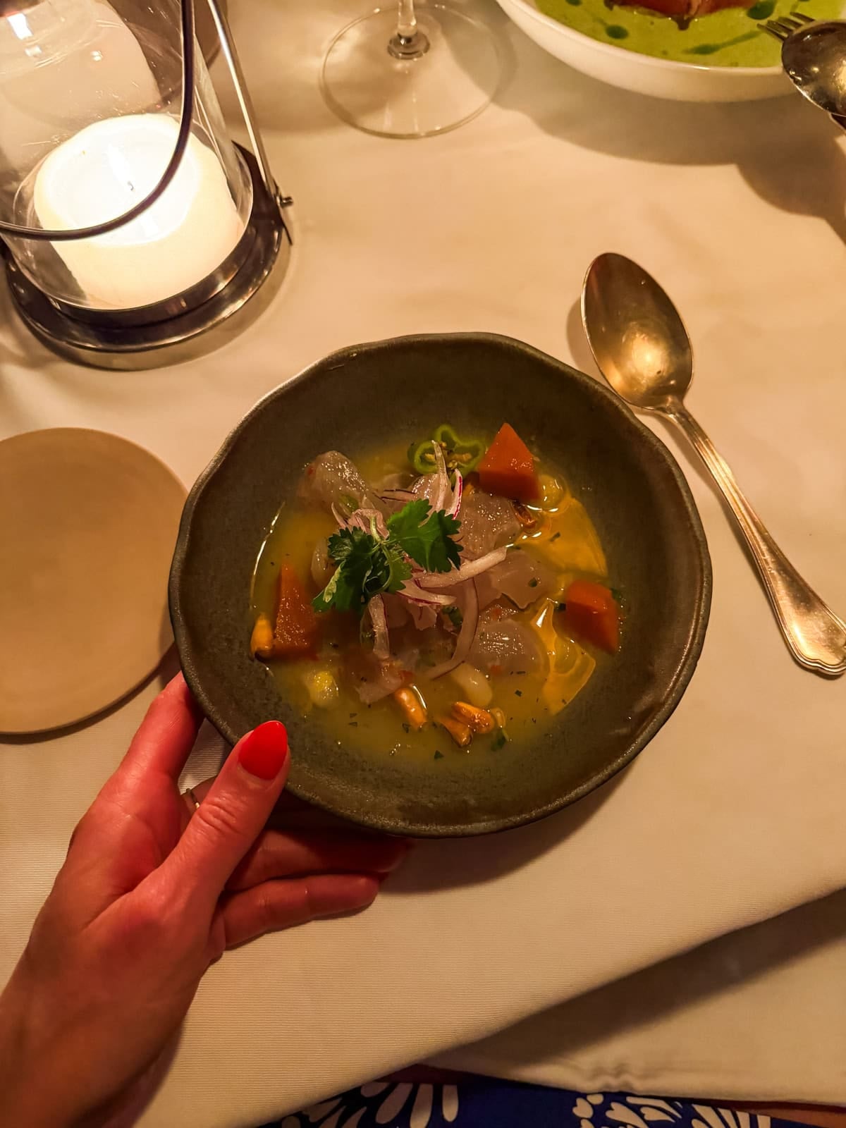 Peruvian ceviche in a dark ceramic bowl at Bonito restaurant in St. Barths