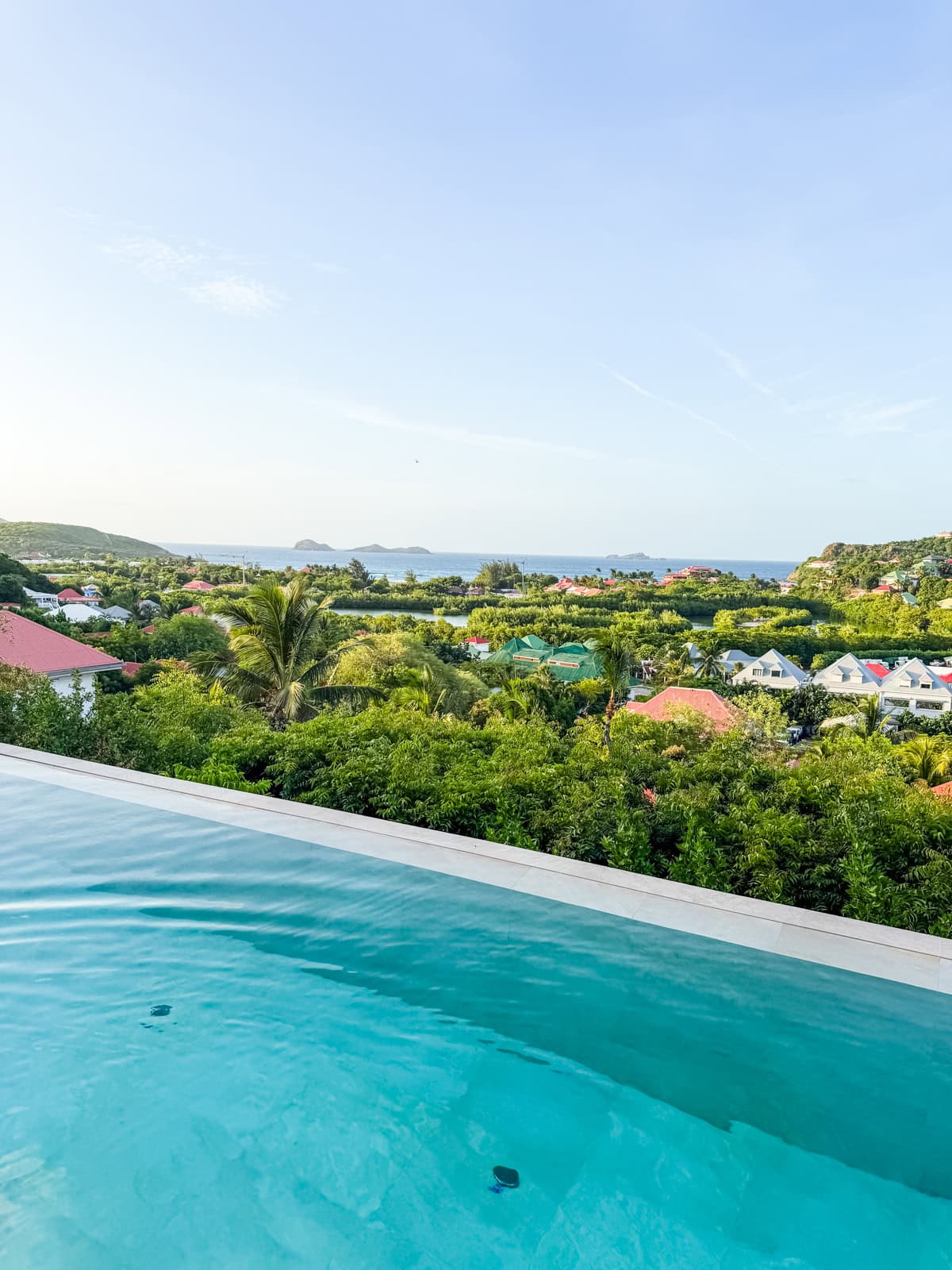 Villa Bonnie infinity pool overlooking lush tropical landscape and ocean views in St. Barths