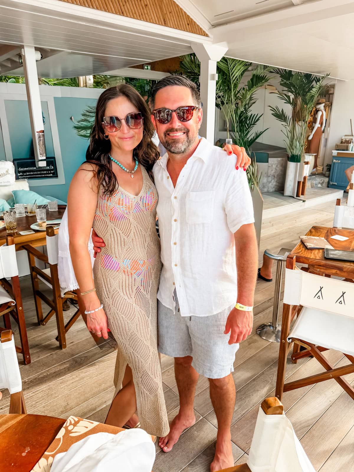 Brittany and Isaac smiling at the Sand Bar restaurant at Eden Rock in St. Barths