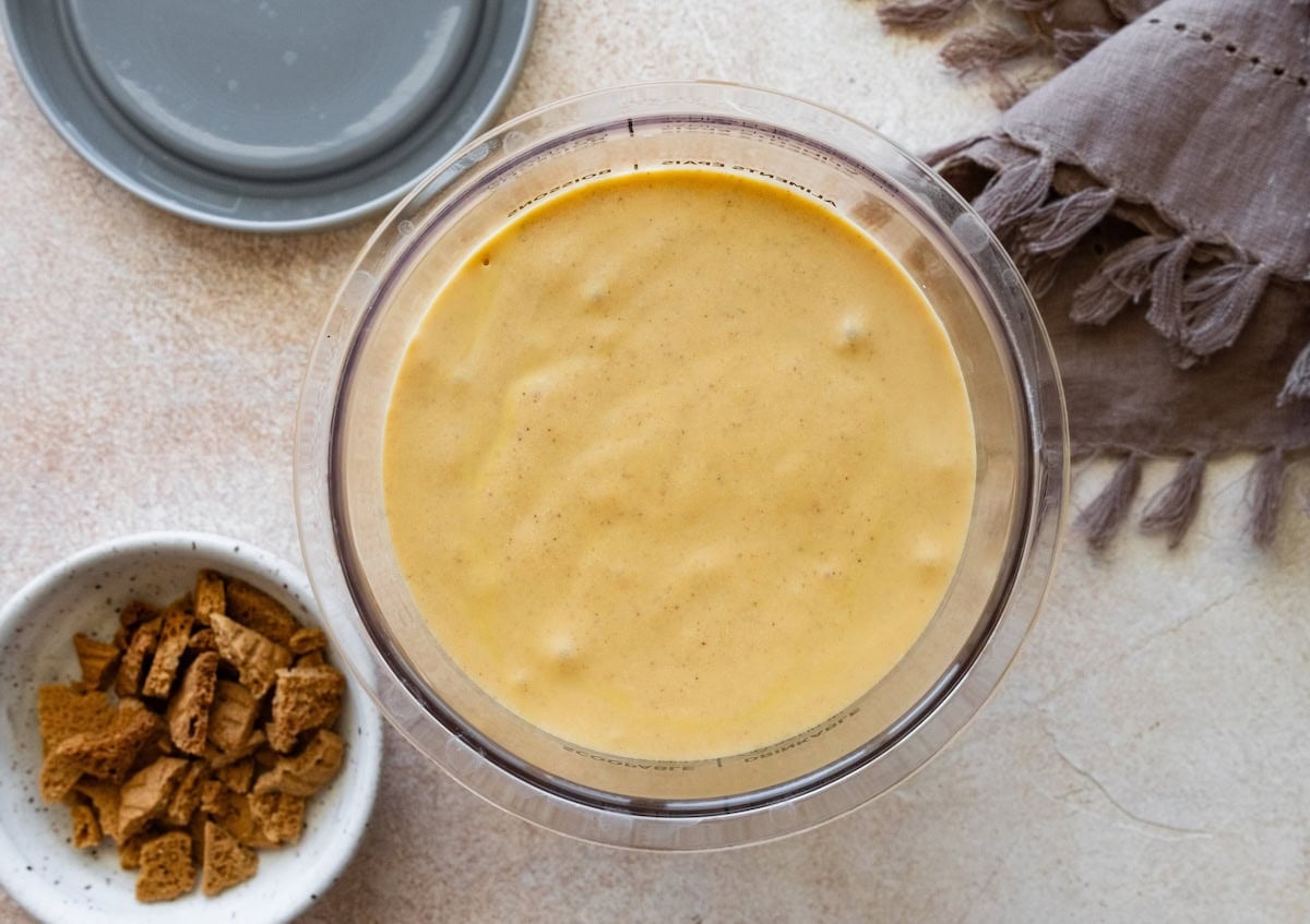 Cottage cheese pumpkin ice cream poured into a Ninja Creami container.