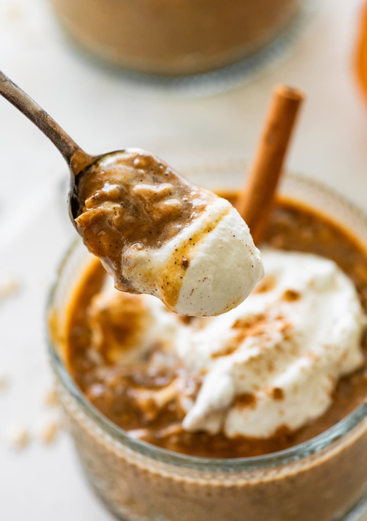 A spoonful of pumpkin spice latte overnight oats with Greek yogurt.