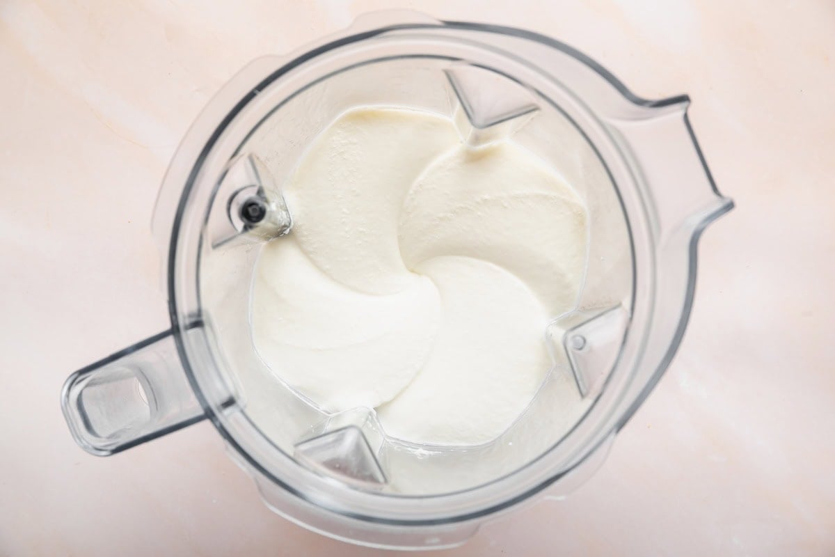 A cottage cheese mixture being mixed in a blender.