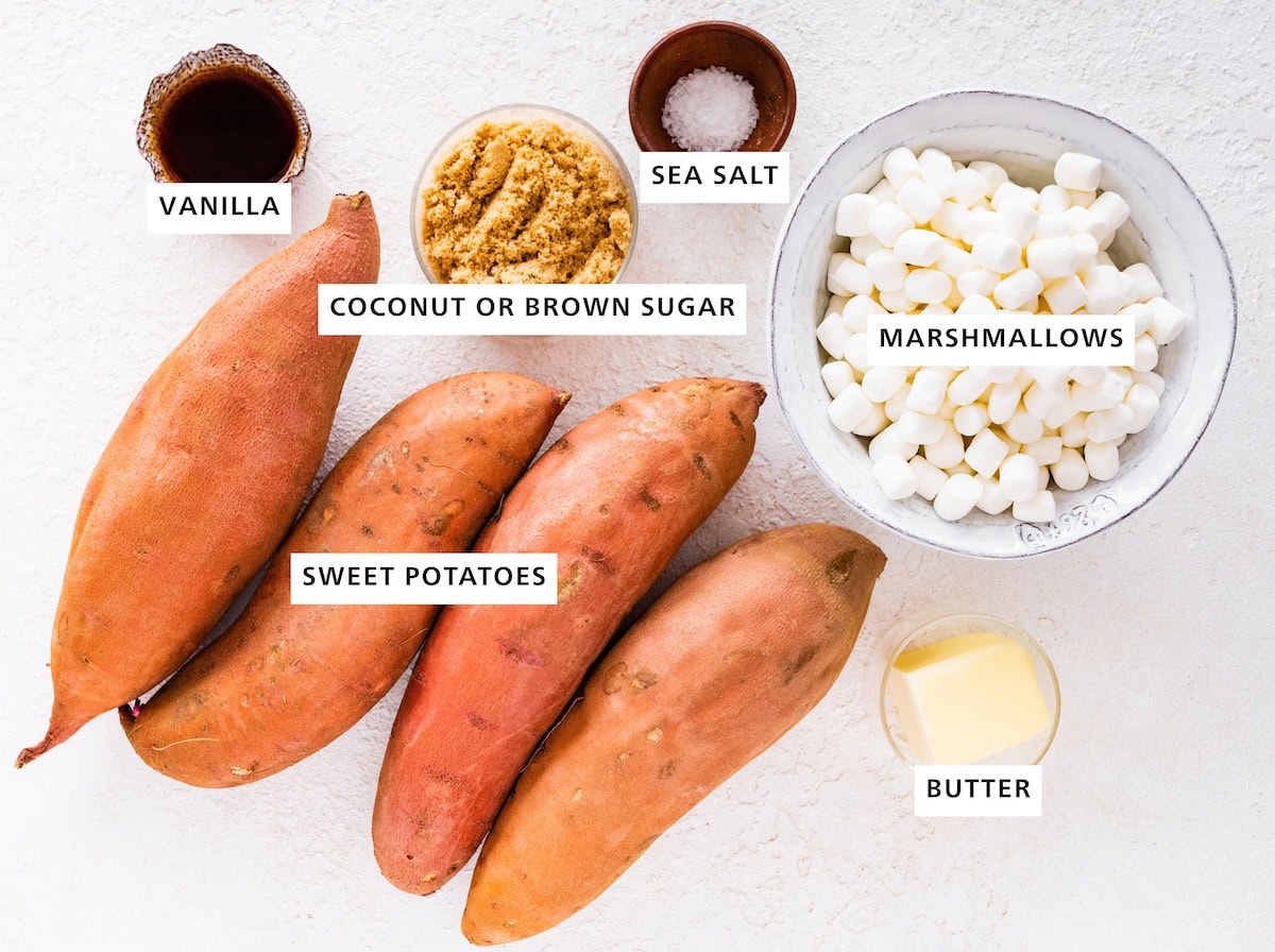 Ingredients measured out to make Classic Sweet Potato Casserole: marshmallows, butter, sea salt, coconut or brown sugar, sweet potatoes and vanilla.