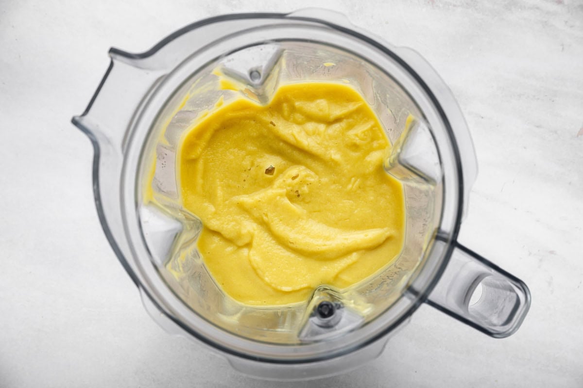 Cauliflower blended with broth until smooth in a blender.