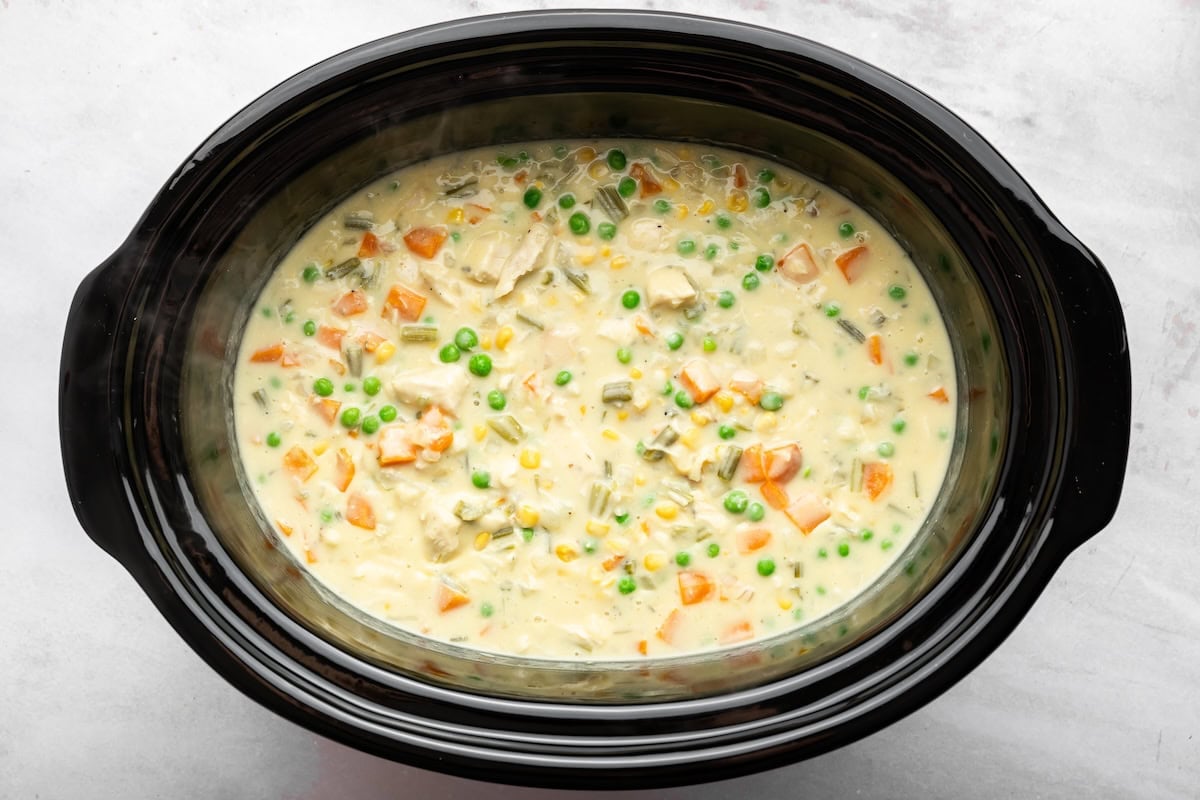 Finished slow cooker chicken pot pie soup with tender chicken and vegetables in a creamy broth.