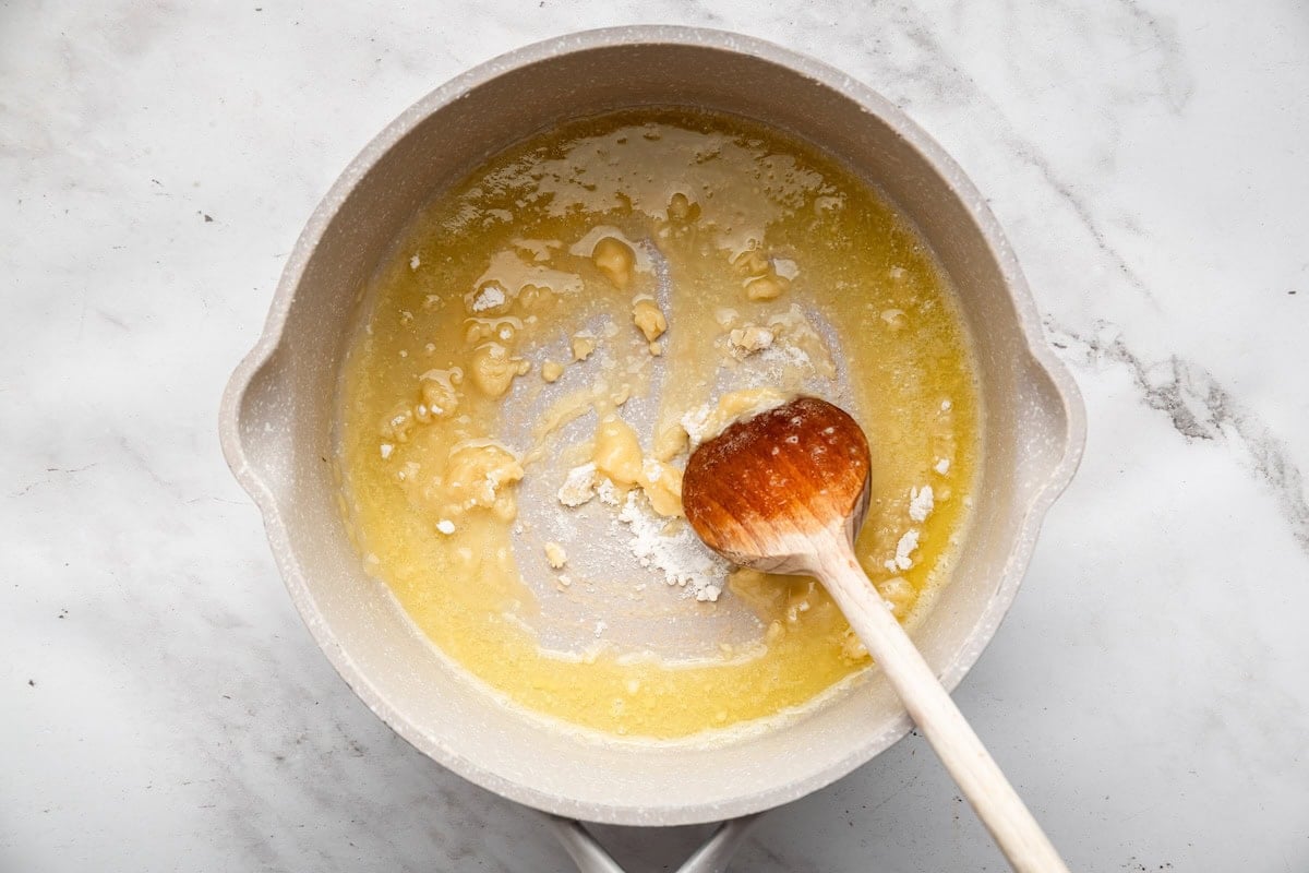 Butter and flour cooking in a saucepan to make the roux for the cream sauce.