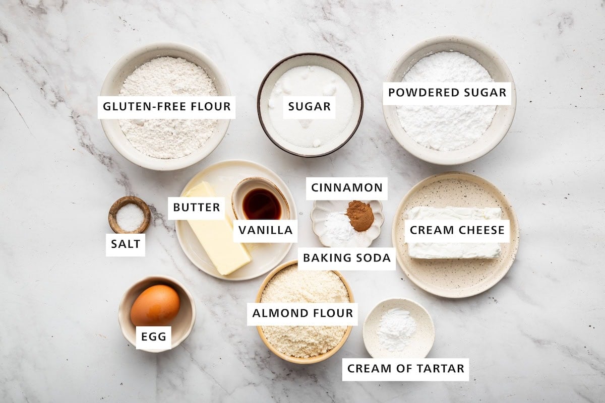 Ingredients for the snickerdoodle sandwich cookies including gluten free flour, sugar, almond flour, powdered sugar, cream cheese and butter.