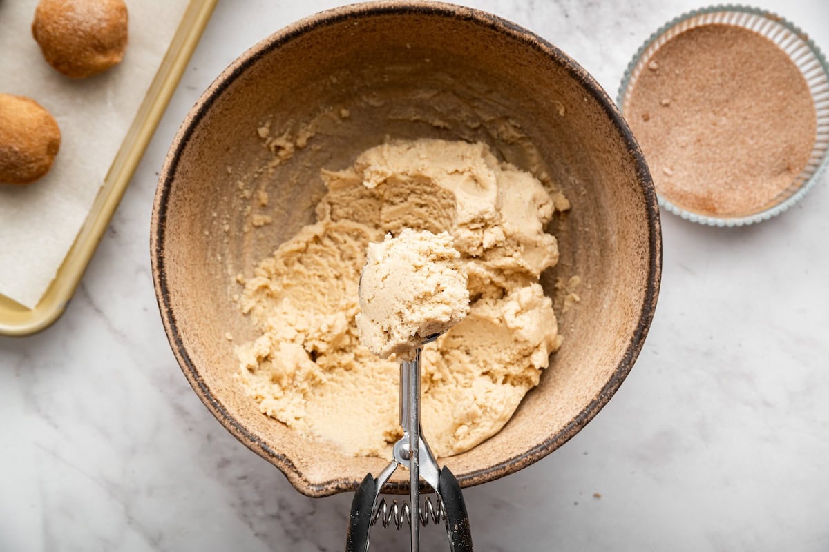 Gluten-free snickerdoodle cookie dough in a mixing bowl.